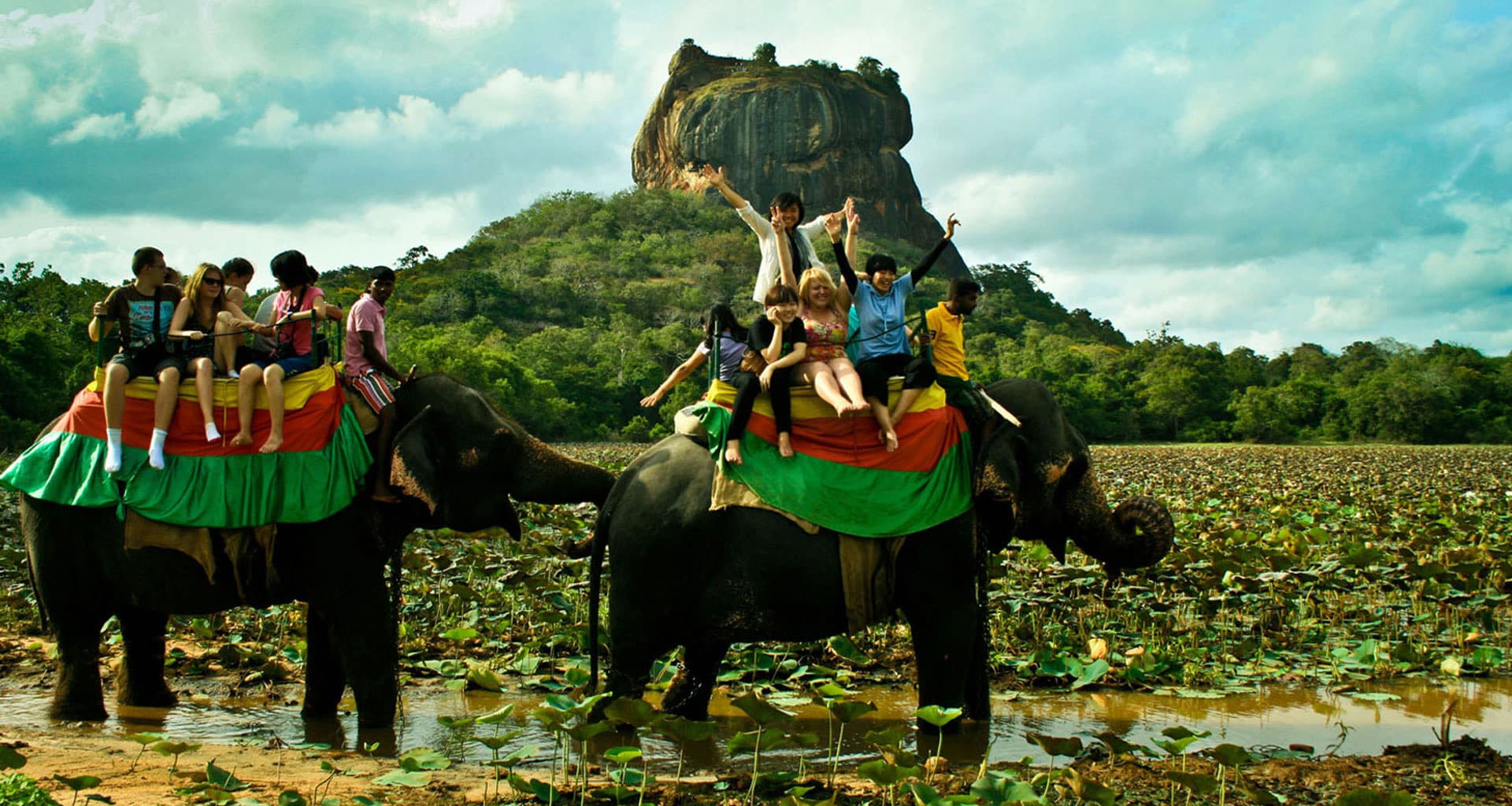Happy travelers on a Paradise Kandy Taxi tour in Sri Lanka